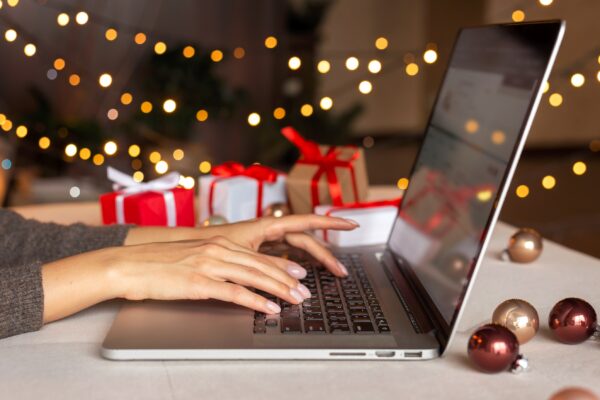 hands of an employee on her laptop during the holidays